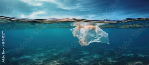 Ocean polluted by a composite photo of plastic bags Copy space image Place for adding text or design