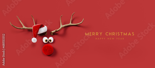 Reindeer with red nose and Santa hat on red background. Christmas greeting card design with text. 3D Rendering, 3D Illustration