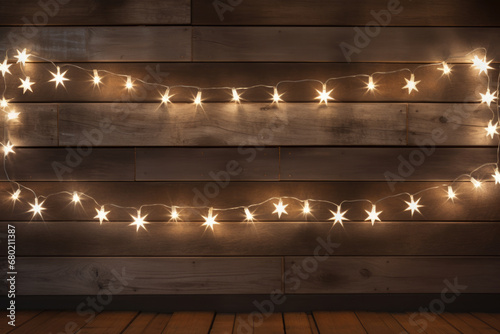 Lightup star studded lights on wooden wall. Festive Christmas background. Copy space for text.