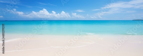Capture the silky smoothness of a white sand beach under a clear blue sky.