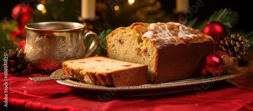 During the holiday breakfast, a scrumptious loaf of apple-carrot-cranberry-walnut pound cake adorned the table, its warm cinnamon scent filling the room against a backdrop of festive decorations.