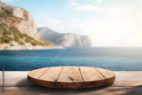 Round wooden board on a wooden table with sea and rocks in the background for displaying purposes. High quality photo.