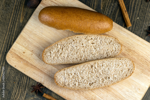 fresh wheat bread with bran on the cutting board