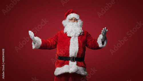 Santa Claus in a welcoming pose, open arms for Christmas cheer