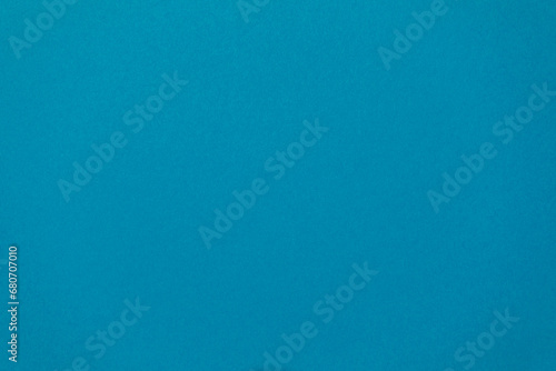 Detail of blue colour paper sheet (school poster board, bristol board) texture. Plain background