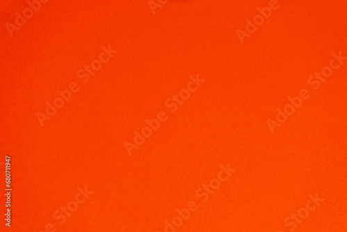 Detail of red colour paper sheet (school poster board, bristol board) texture. Plain background