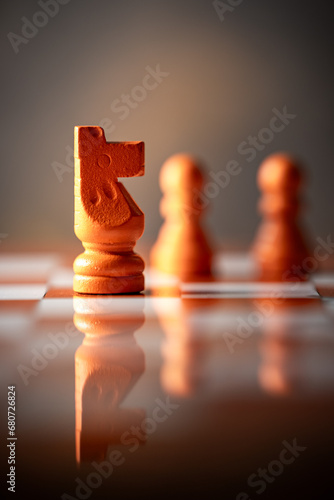 close-up photograph of the horse, a chess piece. Chess is an strategy and intelligence board game. concept of leadership