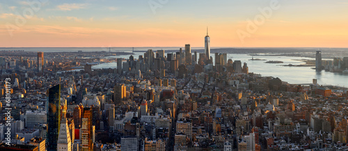 Aerial cityscape of New York City. Panoramic view of Lower Manhattan skyscrapers and Hudson River at Sunset