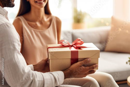 Man and woman in love exchange a gift