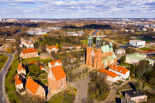 View from drone of ancient Gothic building of Roman Catholic Archcathedral Basilica of St. Peter and St. Paul on island of Ostrow Tumski in Poznan in spring, Poland