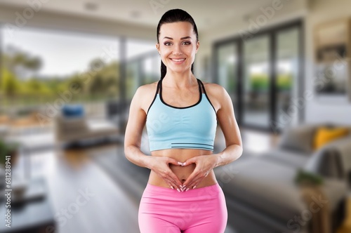 Hands at female stomach for diet and fitness concept
