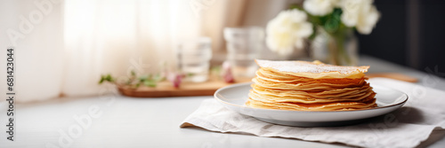 Stack of crepes (french pancakes) on a plate, Chandeleur celebration web banner with copy space