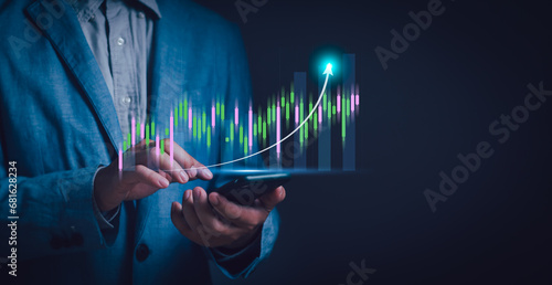 investor or trader Using phone showing virtual stock chart hologram, investment planning and strategy concept, stock market, mutual fund, bonds, digital assets