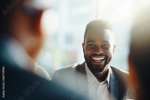 Description: In a spontaneous moment of genuine connection, a Black businessman's laughter fills the room, the authenticity of his joy creating an inviting atmosphere during a corporate meeting.