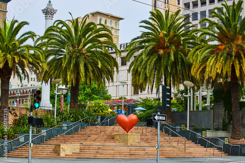 Scenic stairs with red heart in Union Square with tall palm trees San Francisco, CA