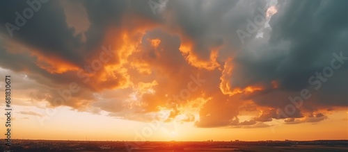 Dramatic stormy clouds at sunset with golden color sky. AI generated