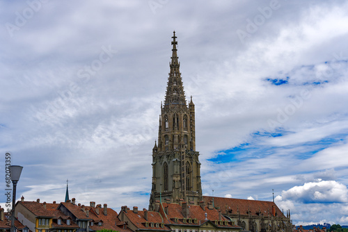 Scenic view of church tower of Minster Church at the old town of Swiss City of Bern on a cloudy summer day. Photo taken July 1st, 2023, Bern, Switzerland.