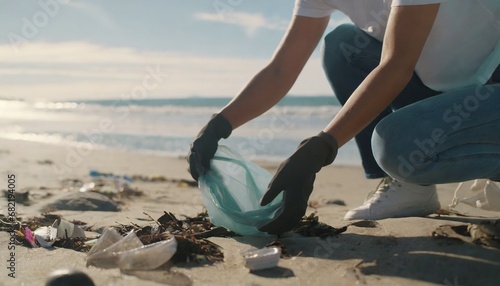Beach cleanup mission Human hands gather waste for a cleaner coast