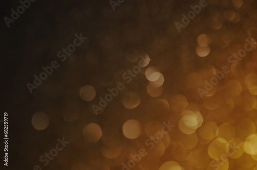 Fondo naranja amarillo con luces efecto bokeh ideal para diseño de navidad/fin de año/fiestas/celebración. Se puede usar como fondo