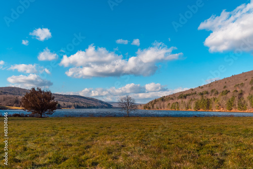 Quaker lake NY, mountain valley landscape late fall weather, sunny windy day