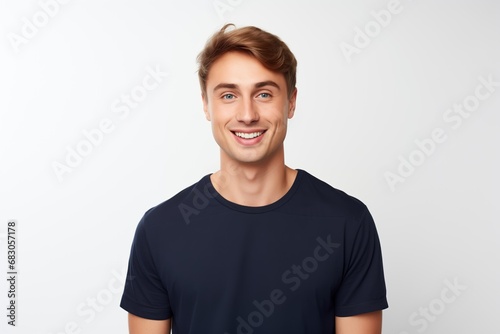 Handsome Fictional Male Model with Blue Eyes Smiling Candidly. Casual Clothes. Isolated on a Plain White Background. Generative AI.