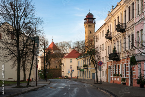View of an old street in the historical center of the city and a fire tower in the background, Grodno, Belarus