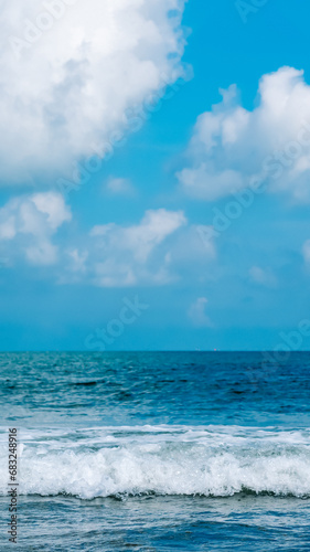 Turquoise clear sea view panorama blue sky white clouds close wave, beauty of nature, skyline. Vertical