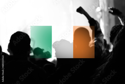 Ireland protest. Protests Dublin. People rise hand. Ireland flag. Demonstration. Out of focus