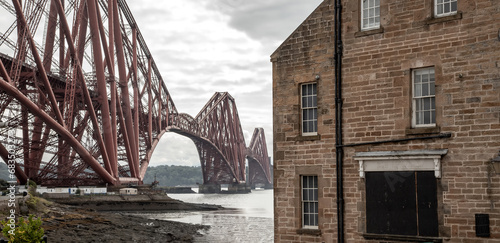 The Forth Bridge, view from North Queensferry town in Edinburgh neighborhood, Scotland industrial landscape