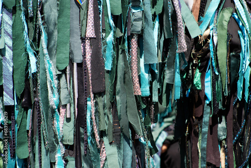 close up detail of rags of a morris man's green costume