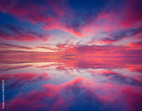 Magnificent view of the sundown over water surface.