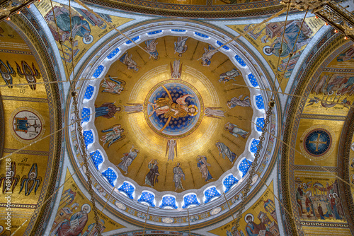 View of the dome of Saint Sava Orthodox Church with mosaic decorations, fresco and Christian icons in Belgrade, Serbia