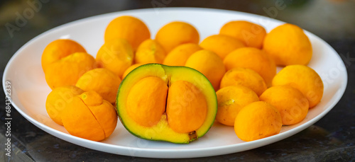 Typical ripe pequi fruit (caryocar brasiliense) in fine details and selective focus. Typical fruit from the Brazilian cerrado bioama.