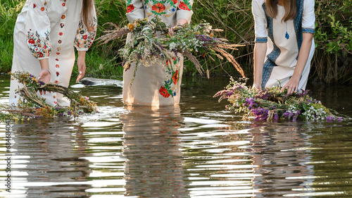 Fortune-telling on wreaths and water, the Ivan Kupala holiday, girls throw wreaths on the water.