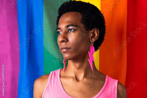 Fashionable homosexual man posing in studio - Fluid gender non binary hispanic man posing in studio with fashionable clothing - concepts about LGBTQ, genderless and diversity