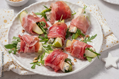 Appetizer with pear, blue cheese and prosciutto ham for holidays