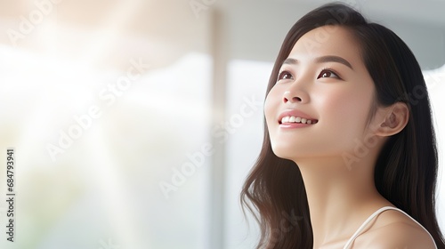 Near up of asian lady considering looking up mindful considering something with satisfied grinning confront stand