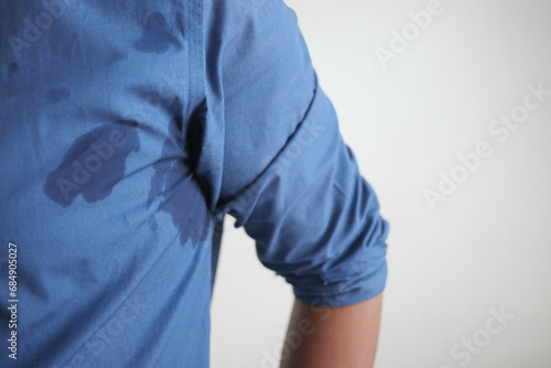 man with wet armpits Smelly odor from sweat .