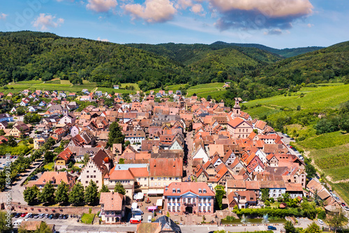 View of Riquewihr village and vineyards on Alsatian Wine Route, France. Most beautiful villages of France, Riquewihr in Alsace, famous "vine rote". Colorful town of Riquewihr, Alsace, France.