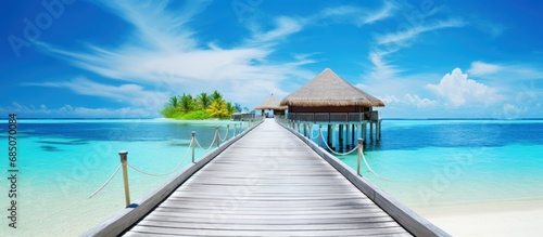 Exotic summer getaway stunning Maldives with tropical landscapes wooden bridge water villas and beautiful island beaches copy space image