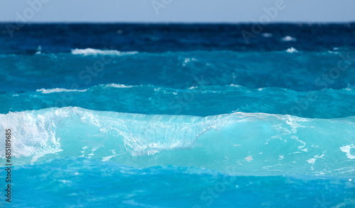 Cancun beach with white sand and blue waves
