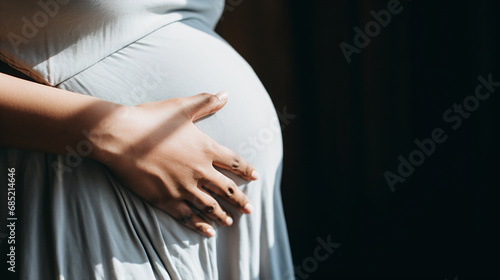 Expectant Mother Embracing Her Belly in Sunlit Room Maternity and Pregnancy Concepts