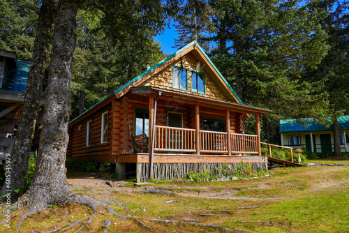 Log house of the Historic Taku Glacier Lodge, a wooden cabin located on the shores of a melt water lake in the mountains north of the Alaskan capital city Juneau