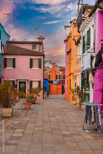 Explore the vibrant and colorful streets of Burano, Venice, Italy. This captivating image captures the essence of the charming and picturesque architecture found in this unique island town.