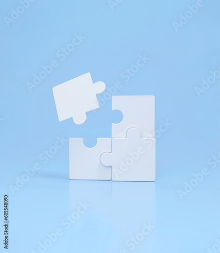 Connecting puzzle pieces on blue background. Idea, solution, strategy concept, business.