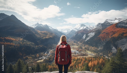 Fearless traveler woman embracing majestic mountain view, immersed in the serene beauty of nature.