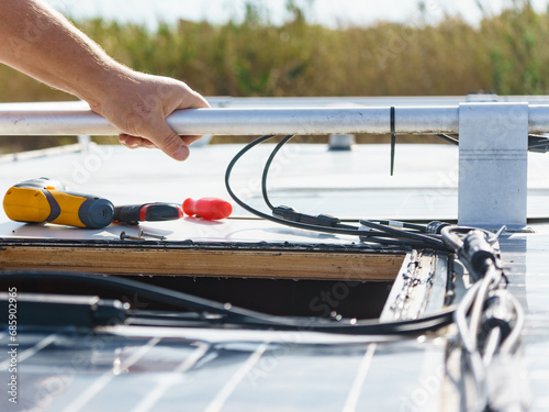 RV solar panel installation. Caravan roof repair