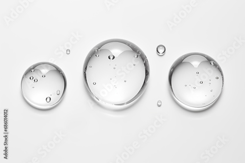 transparent drops collection colorless, different sizes, glycerin gel makeup with clear bubbles on white