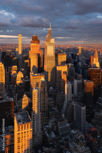New York City aerial view of Midtown Manhattan skyscrapers and long shadows at sunset