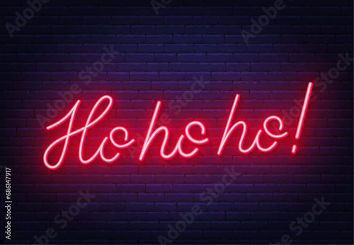Ho ho ho neon lettering on brick wall background